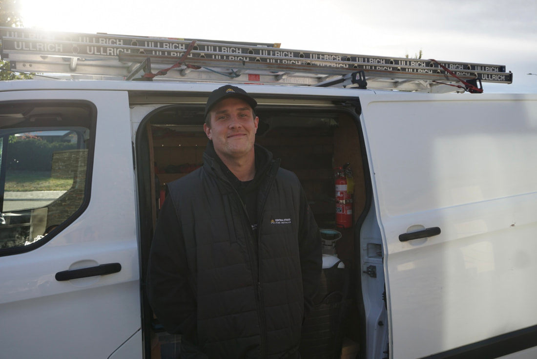 Mac standing at the Central Otago Fire Installs van